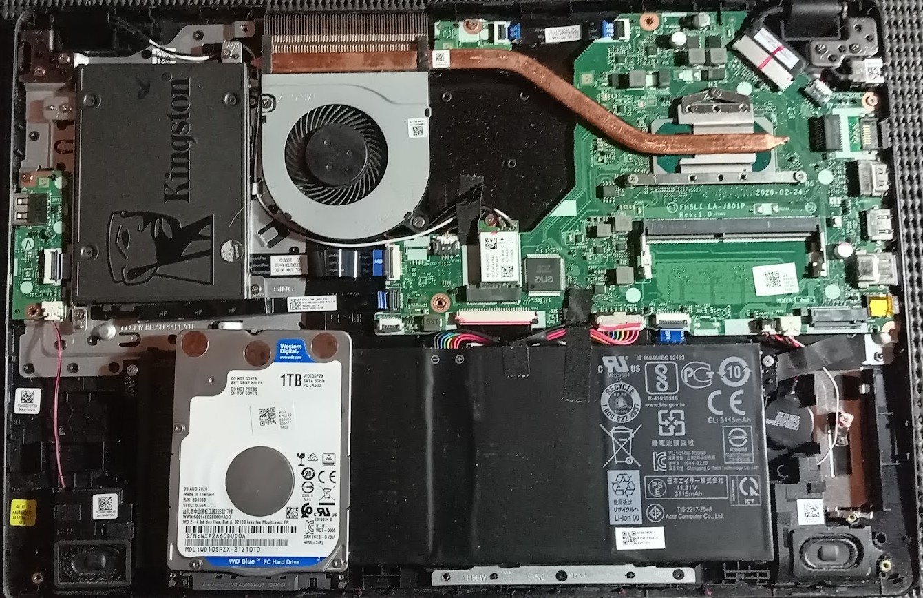 Inside picture of a laptop. Notice Kingston SATA SSD and the Western Digital Hard Drive.
